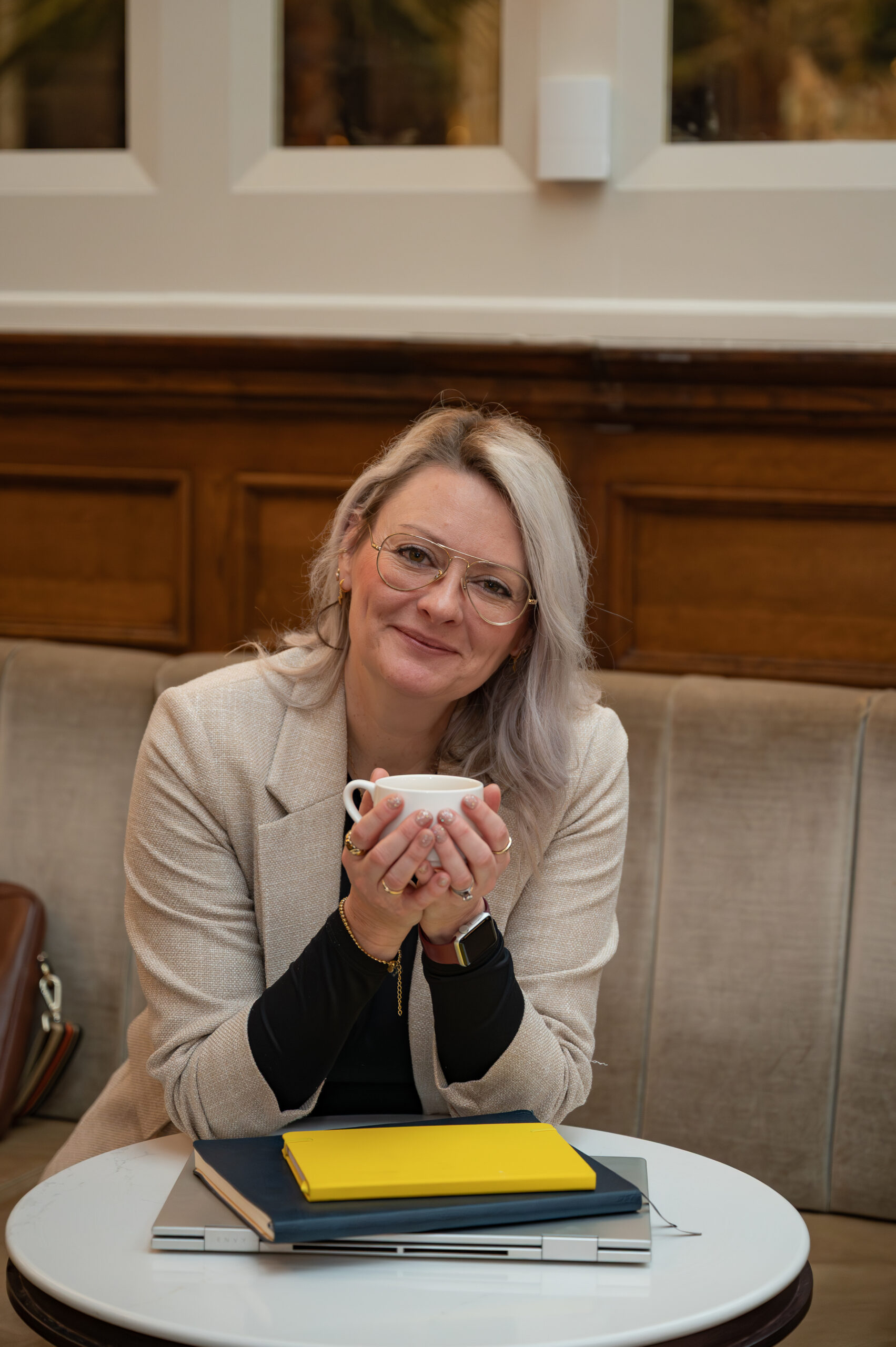 Jo holding a cup of tea by Kayleigh